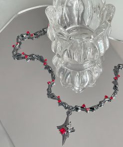 Alternative view of Gunmetal black thorn and red rhinestone cross pendant necklace for women, a unique Y2K style European and American inspired clavicle chain.