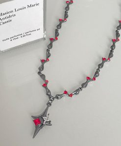 Gunmetal black thorn and red rhinestone cross pendant necklace for women, a unique Y2K style European and American inspired clavicle chain.